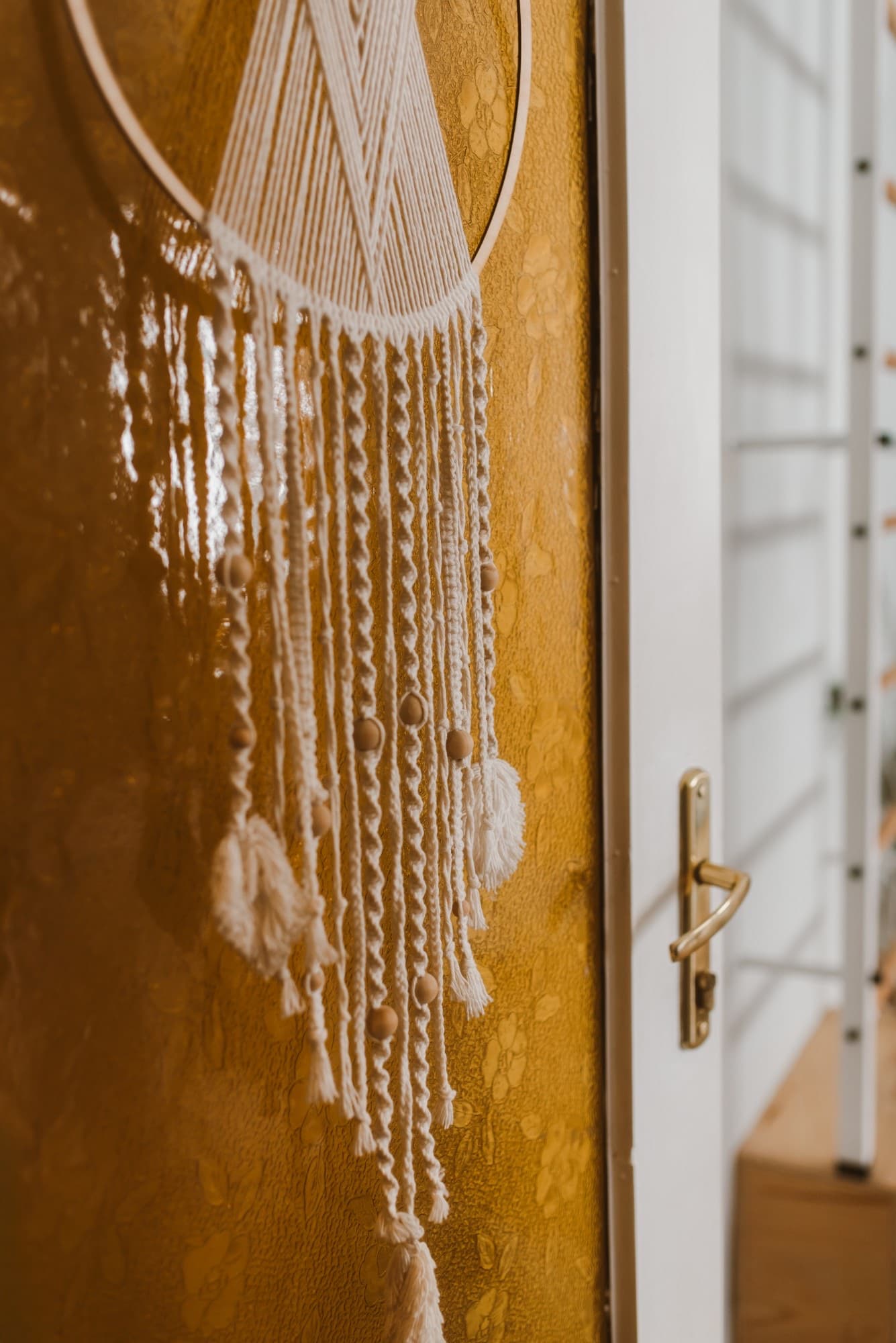Macramé on an old amber-glass door