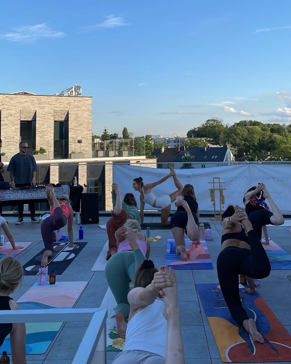 Yoga on a rooftop terrace with live music