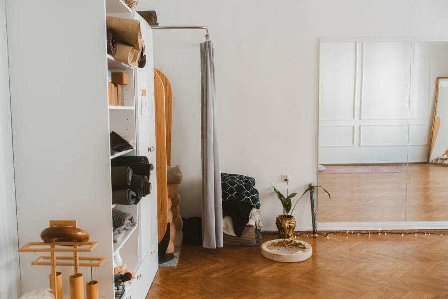 An equipment cabinet, mirror and parquet in the studio