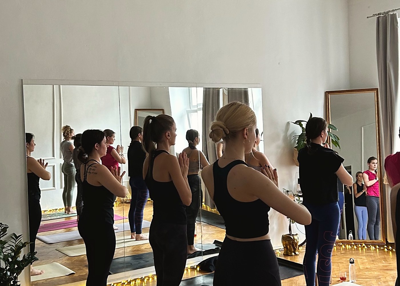 A group during class by the mirrors