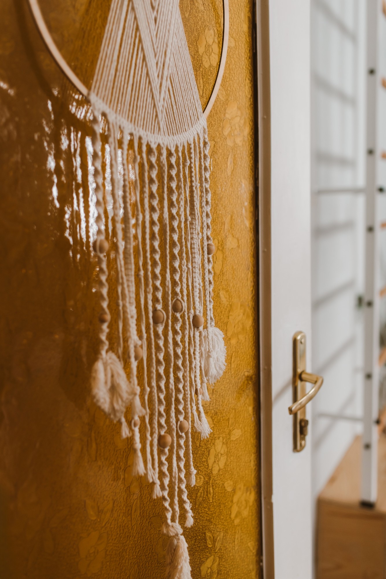 Macramé on an old amber-glass door